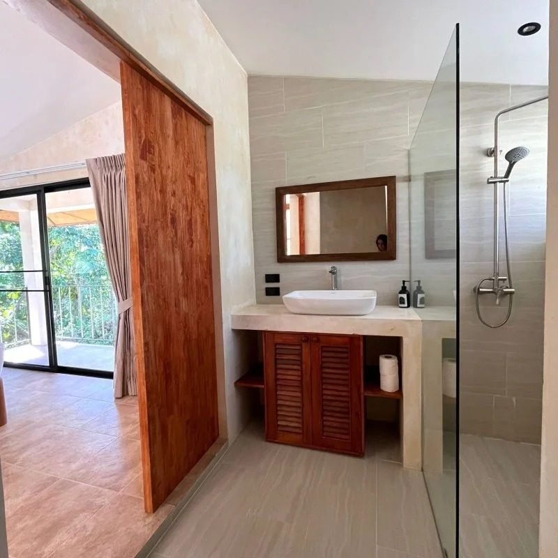 Bathroom with walk-in shower in the Luxury 1-Bedroom Villa at Arcana