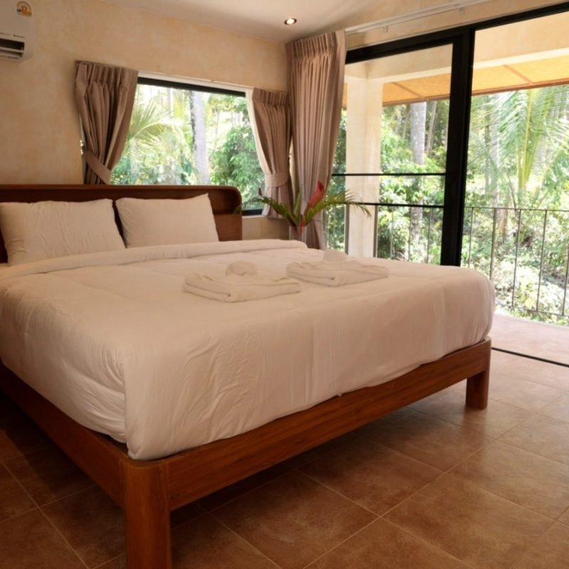 King-size bedroom with garden views in the Luxury 1-Bedroom Villa at Arcana
